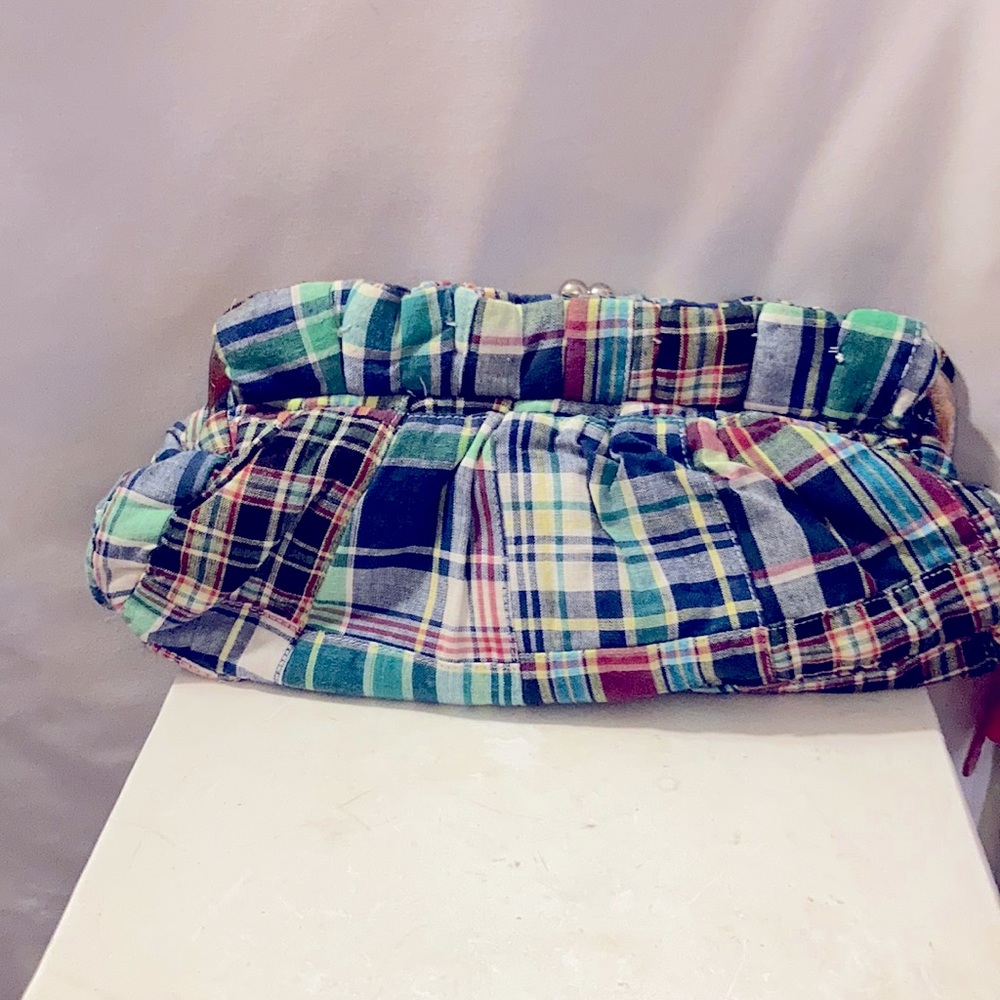 Multiple colored fabrics clutch.